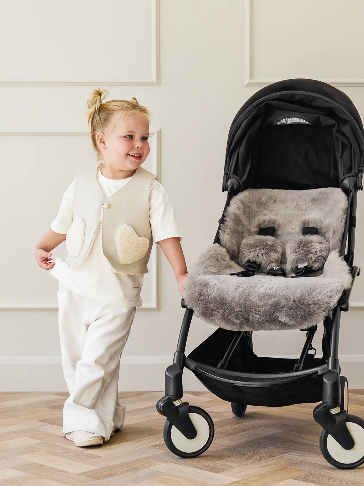 Edith White Shearling Heart Gilet | Kids | Gushlow & Cole-on model with pram