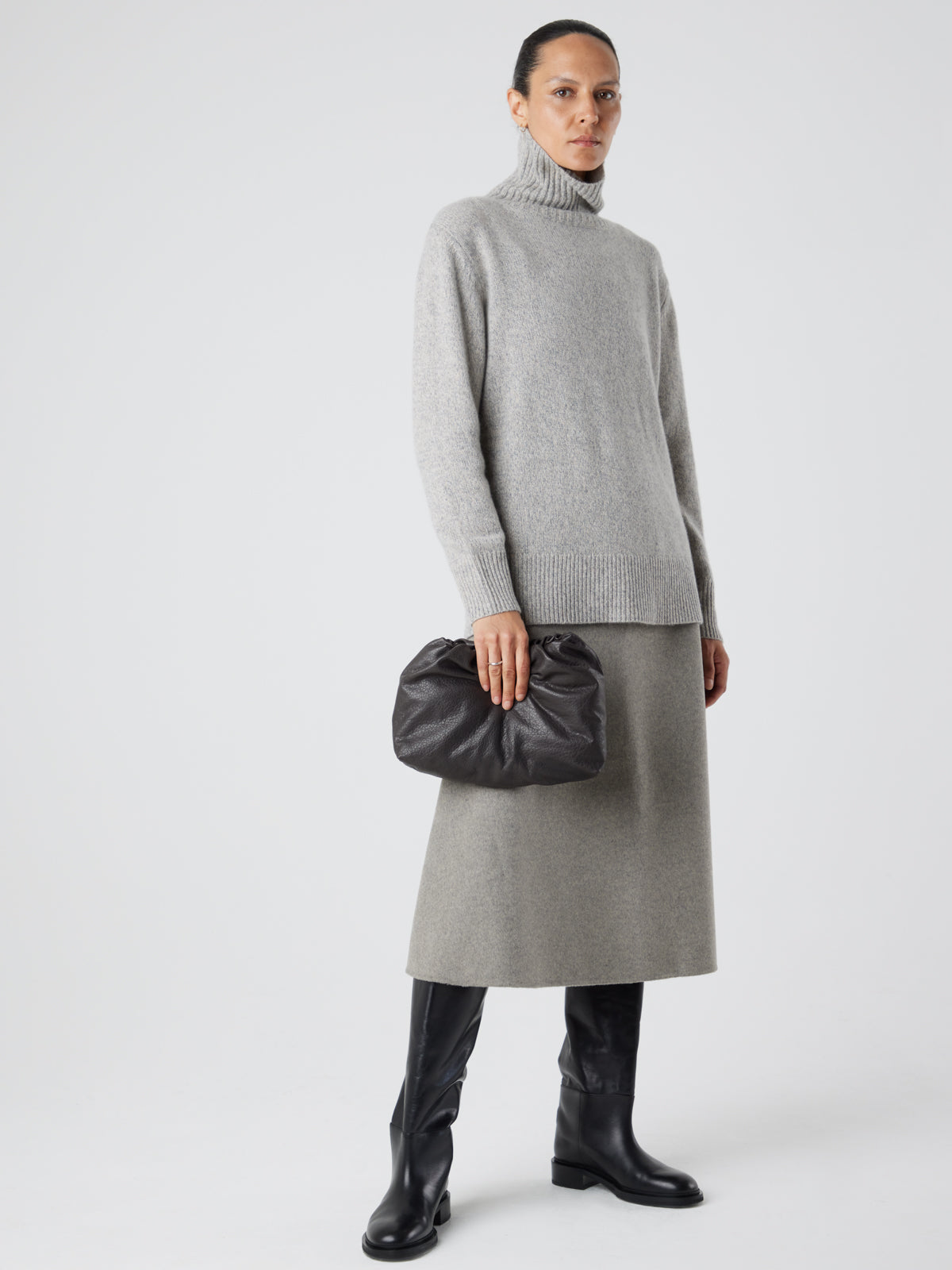 English Nappa Leather Soft English Nappa Clutch Bag in Storm Brown | Womens | Gushlow & Cole- model holding bag down