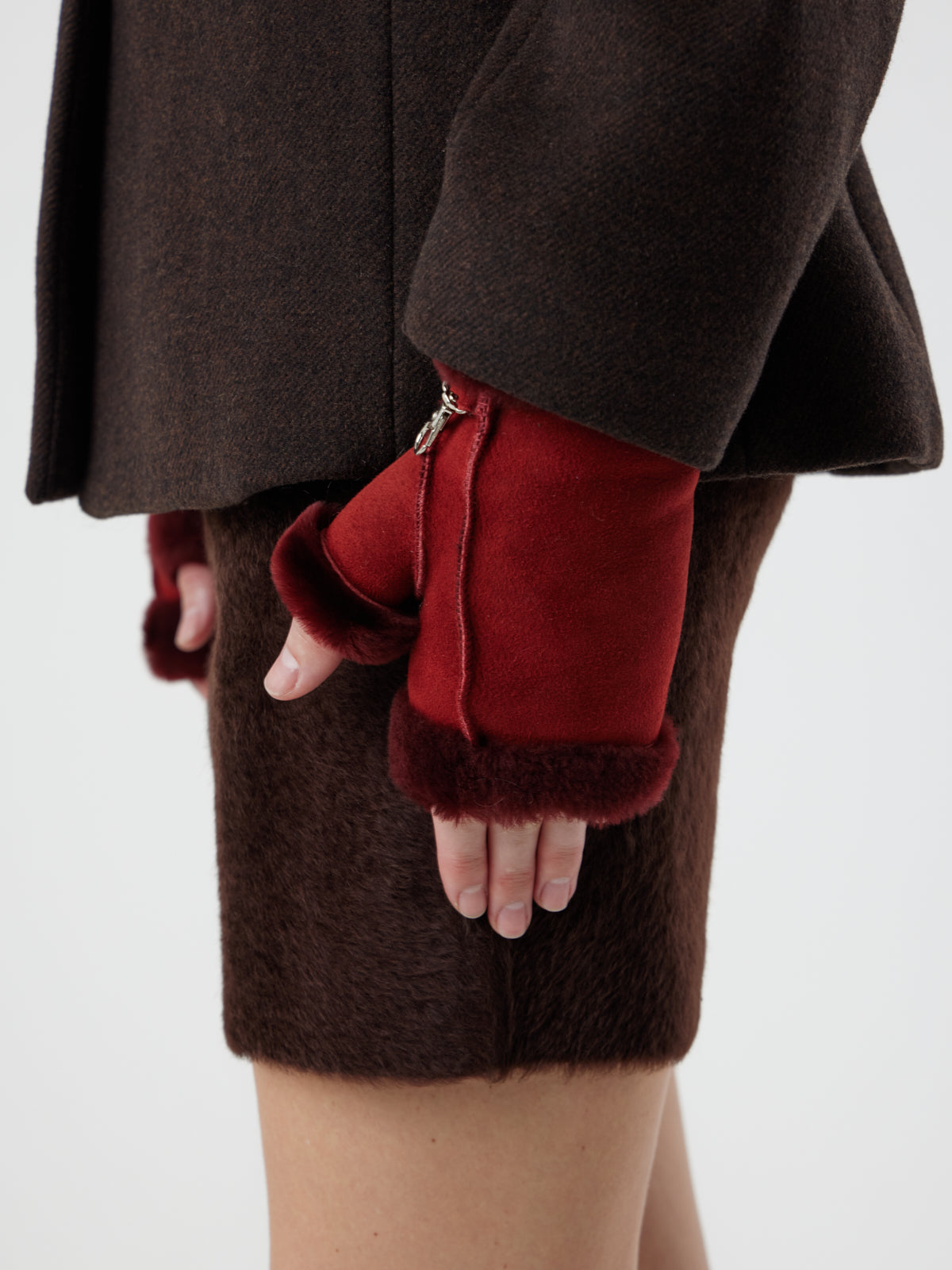 woman wearing Fingerless Red Shearling Mittens by Gushlow & Cole