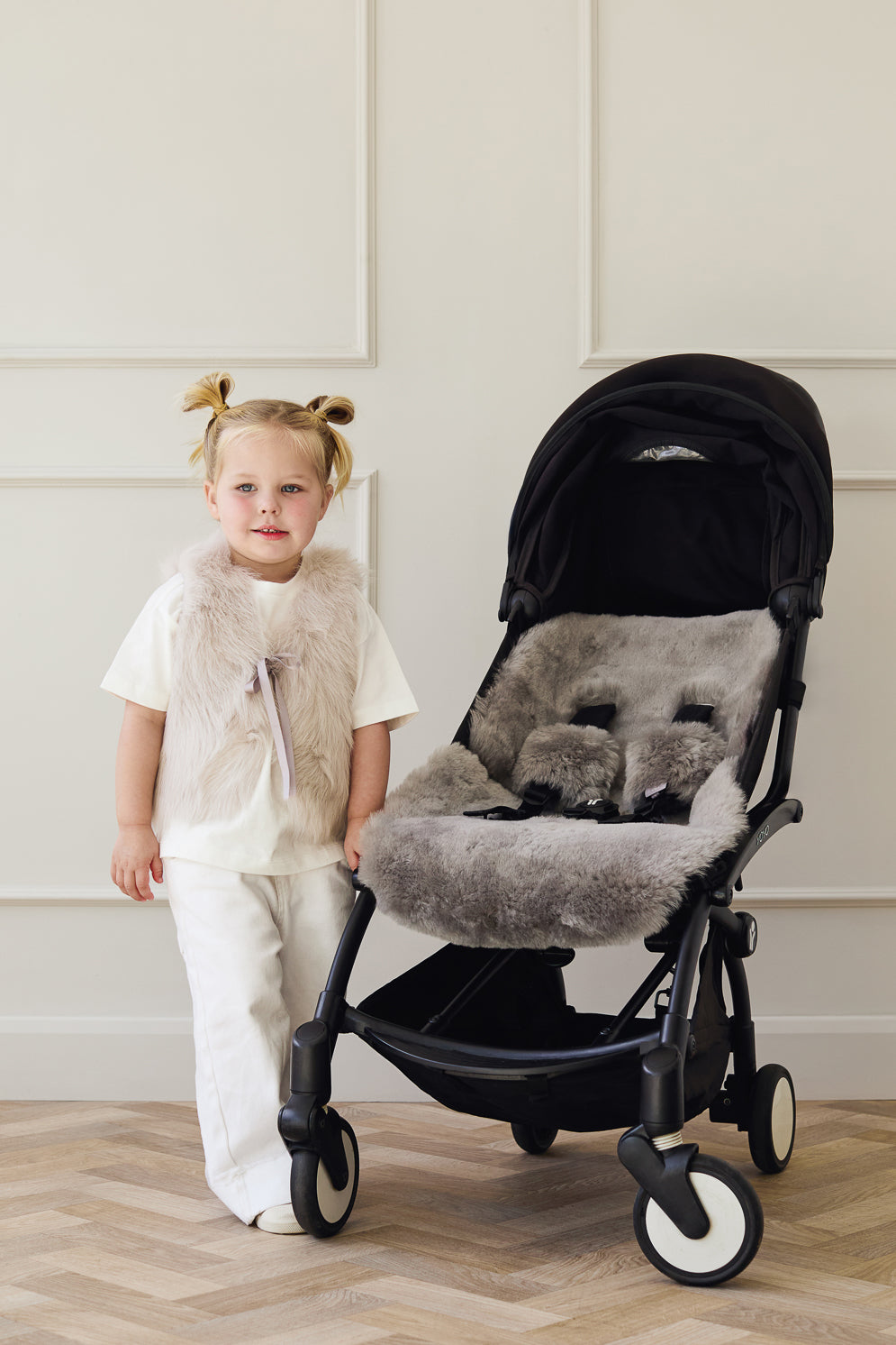 Grey Sheepskin Pram Liner & Strap Cover | Kids | Gushlow & Cole - model next to pram liner