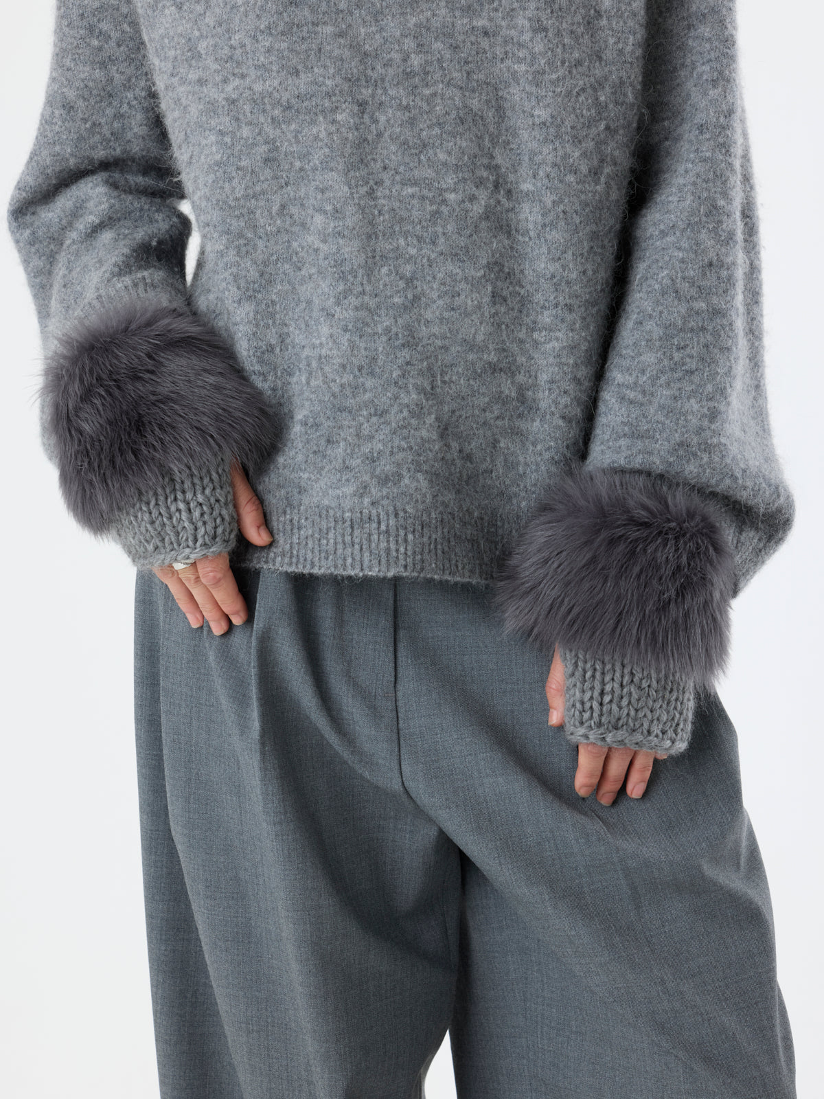 woman wearing Grey Shearling and Knit Mittens by Gushlow & Cole over grey outfit