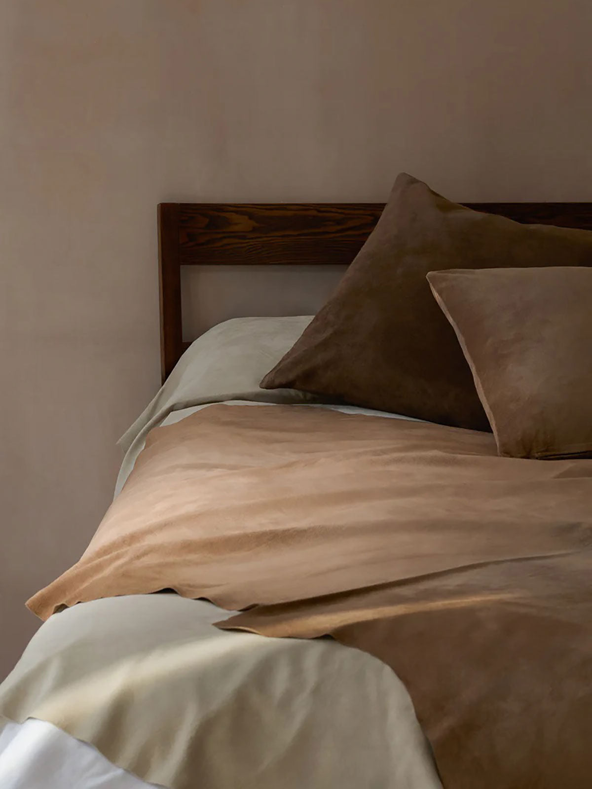 Large Camel Suede Throw | Home | Gushlow & Cole - lifestyle image of suede throw on bed with suede cushions