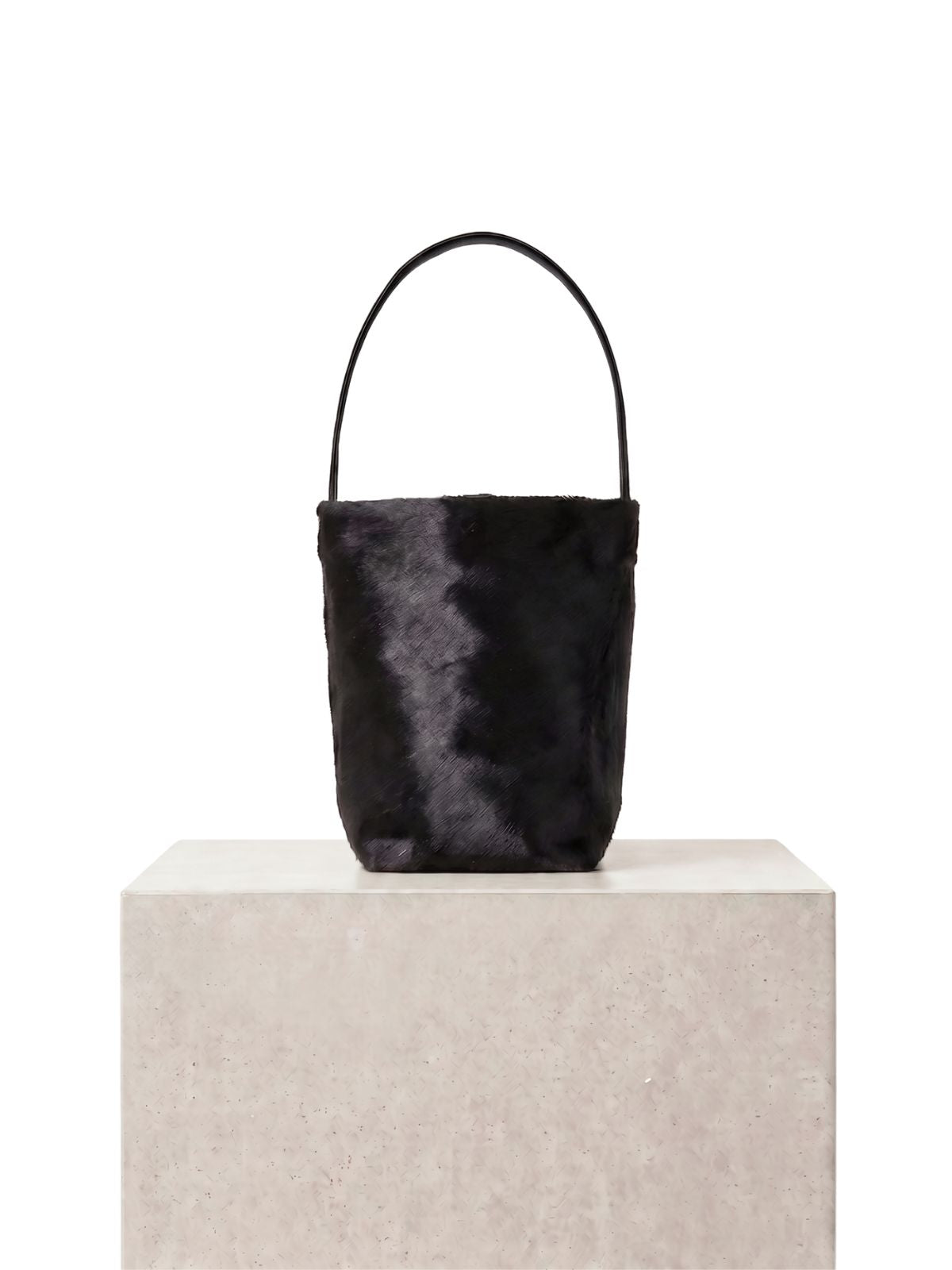 maye small black bucket tote bag by gushlow & cole on plinth