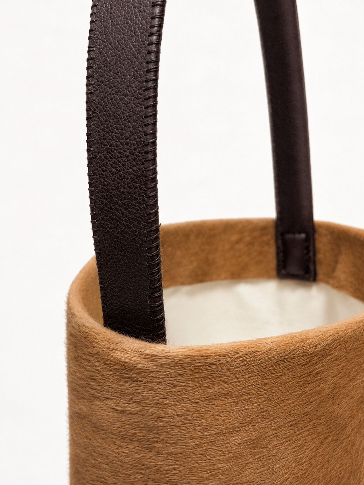 crop in of maye small camel bucket tote bag by gushlow & cole on white background