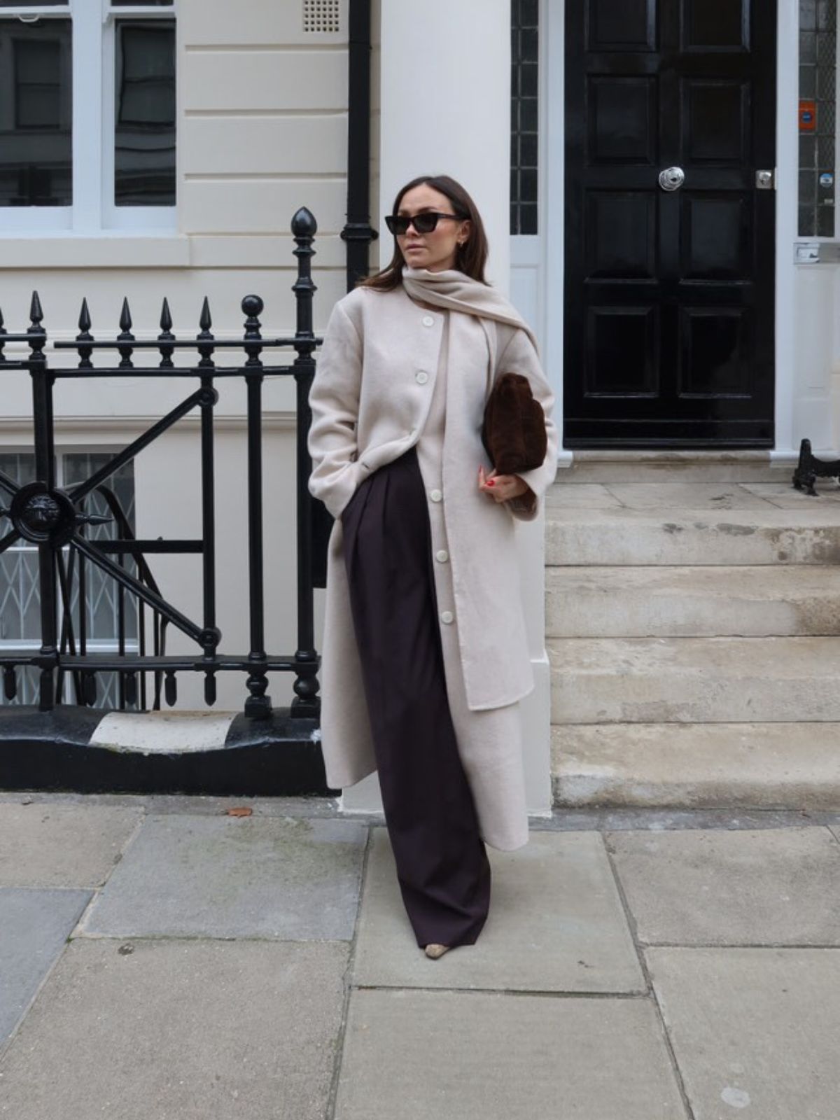 Merino Soft Shearling Clutch Bag | Womens | Gushlow & Cole - model holding bag with cream coat