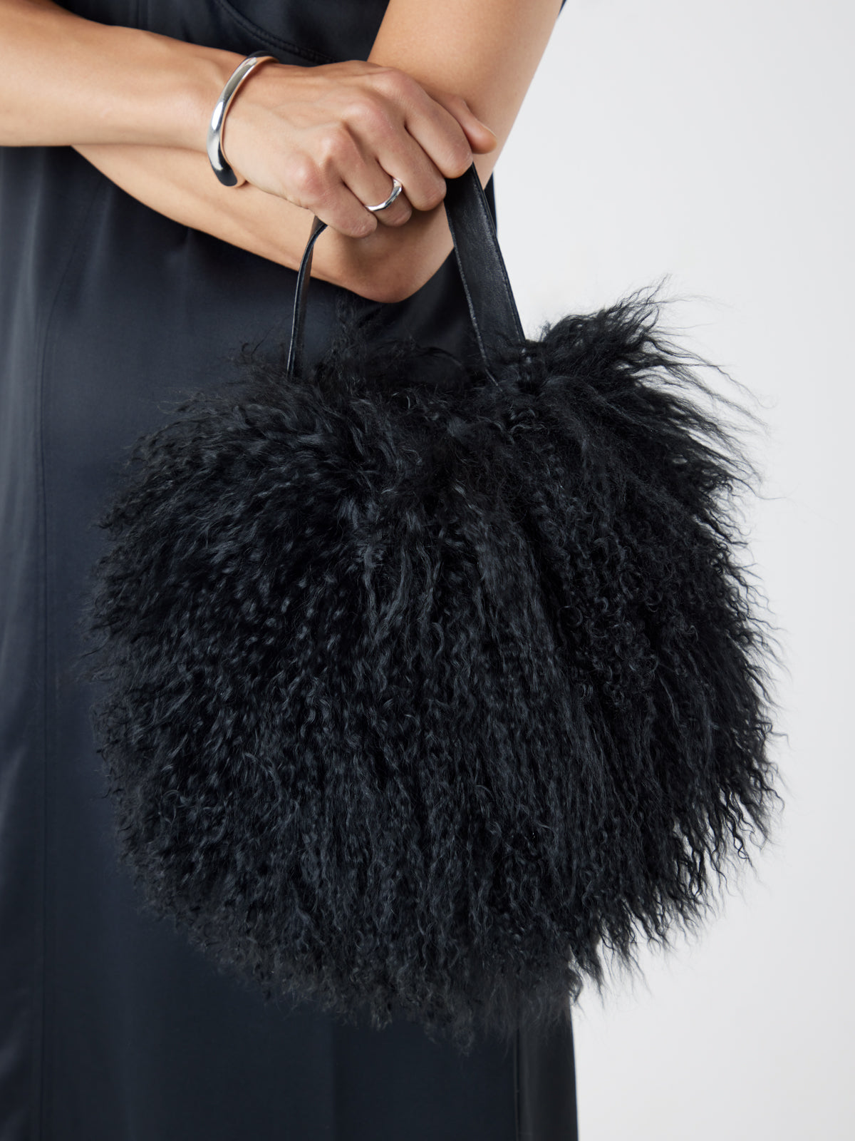 Mongolian Shearling Black Saddle Bag | Womens | Gushlow & Cole-model with bag cropped in