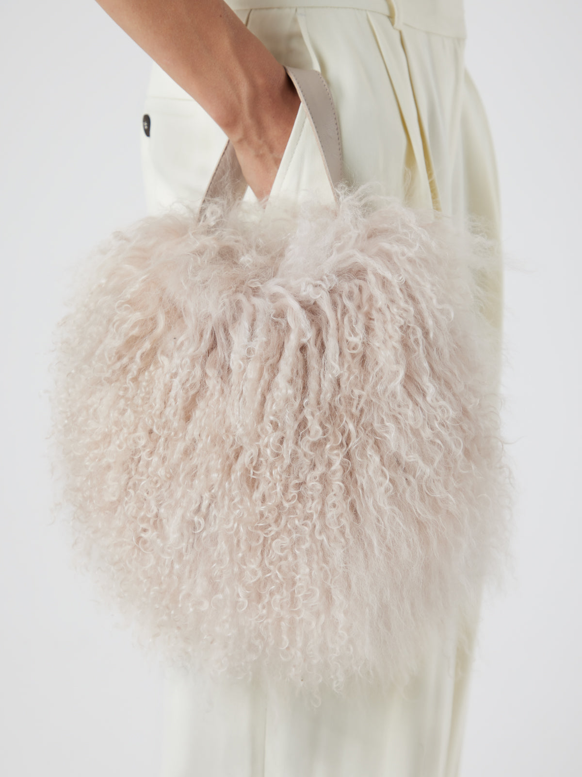 Mongolian Shearling Cream Saddle Bag | Bags | Gushlow & Cole - model crop in