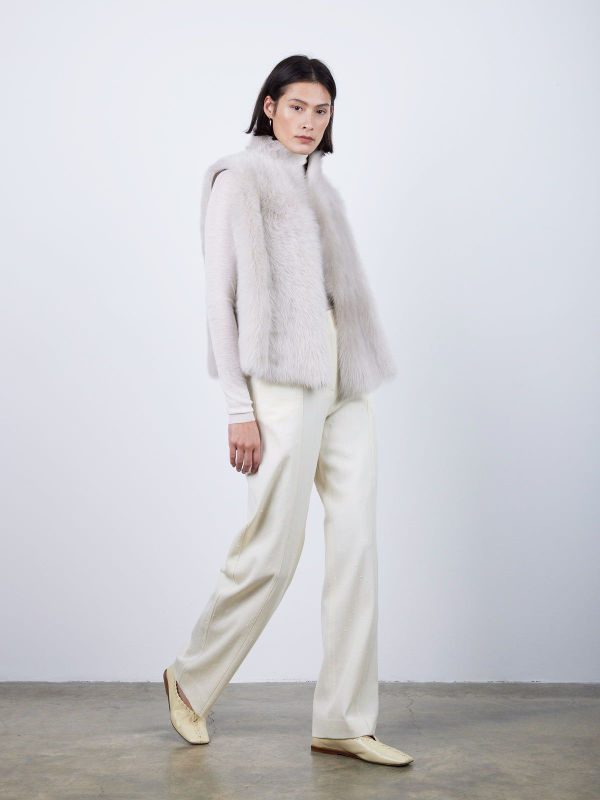 Natural Edge Oyster White Shearling Gilet | Womens | Gushlow & Cole- full length model front walking