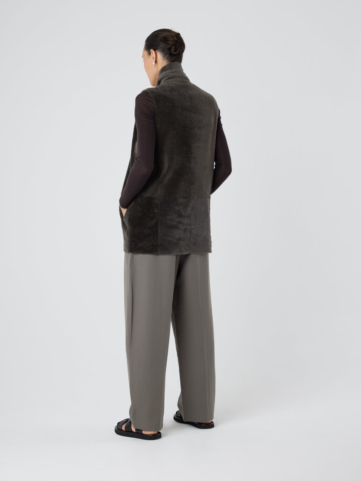 Natural Edge Storm Green Mid Length Shearling Gilet - model full length back wool out