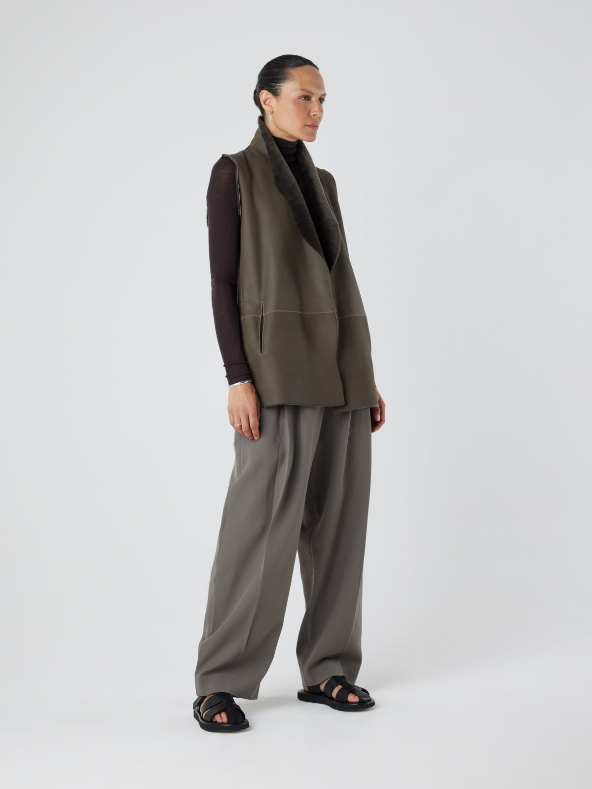 Natural Edge Storm Green Mid Length Shearling Gilet - model full length side leather out