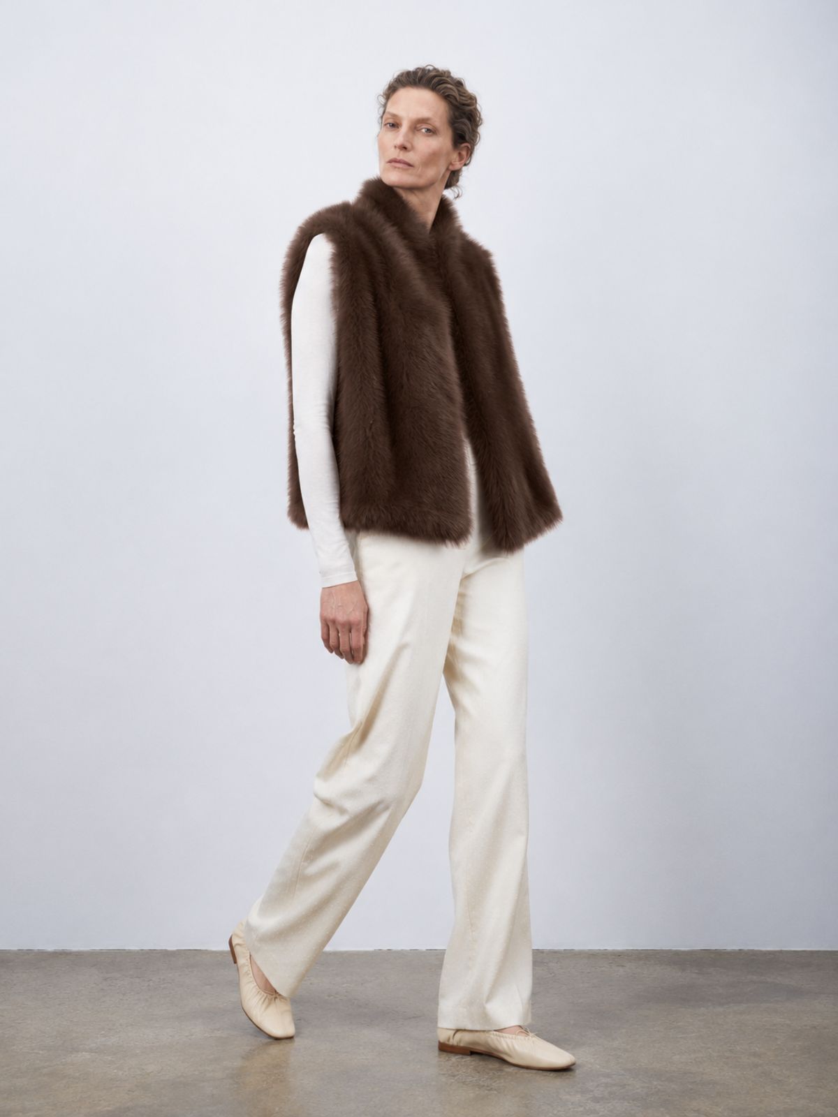 woman wearing natural edge brown shearling gilet by gushlow & cole