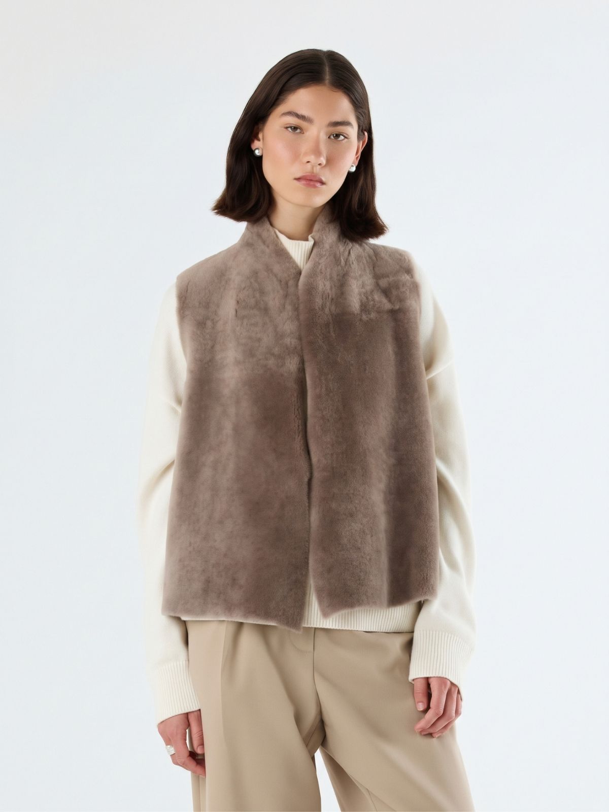 woman wearing natural edge taupe shearling gilet by gushlow & cole