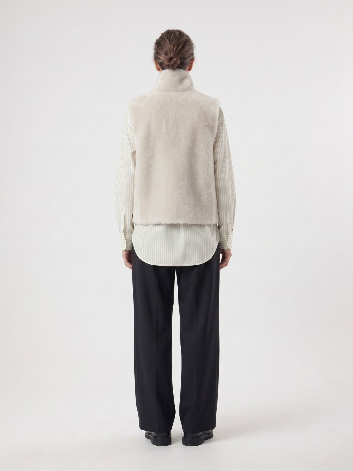 back view of woman wearing Natural Edge White Shearling Gilet by gushlow and cole