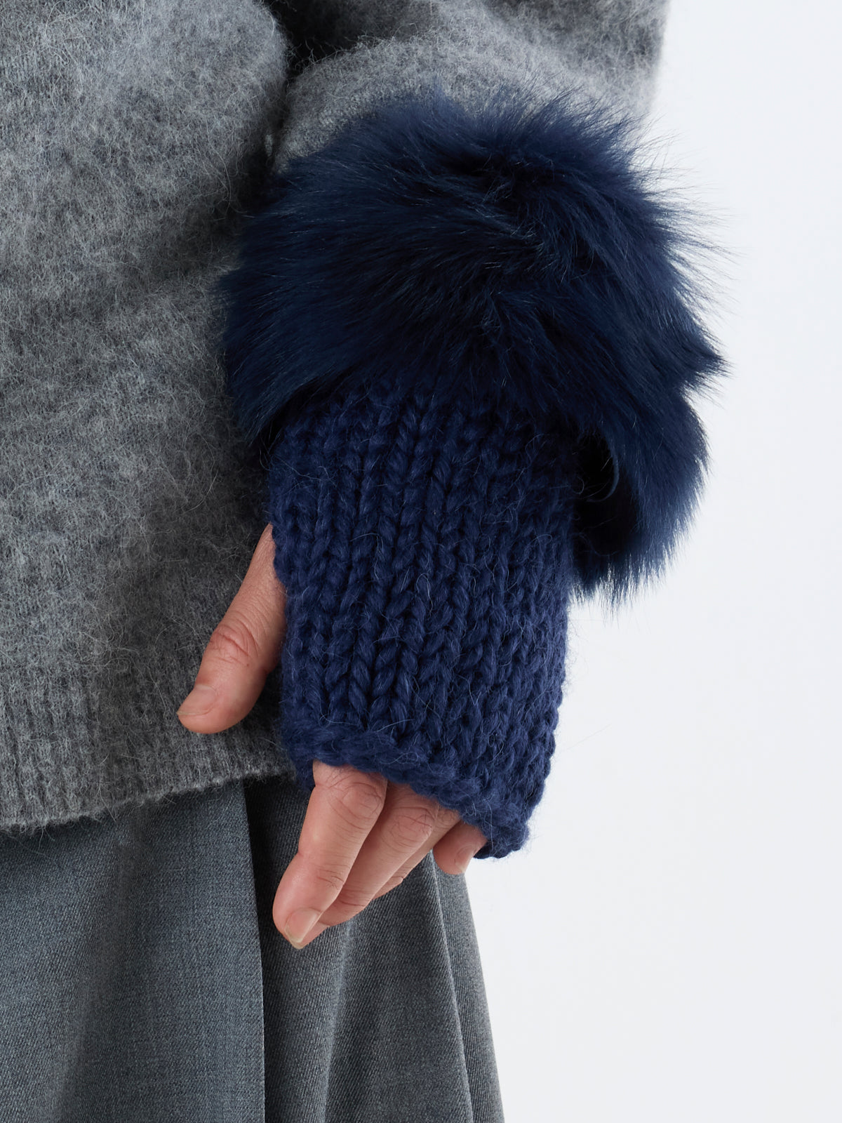 woman wearing Navy Shearling and Knit Mittens by Gushlow & Cole on grey outfit