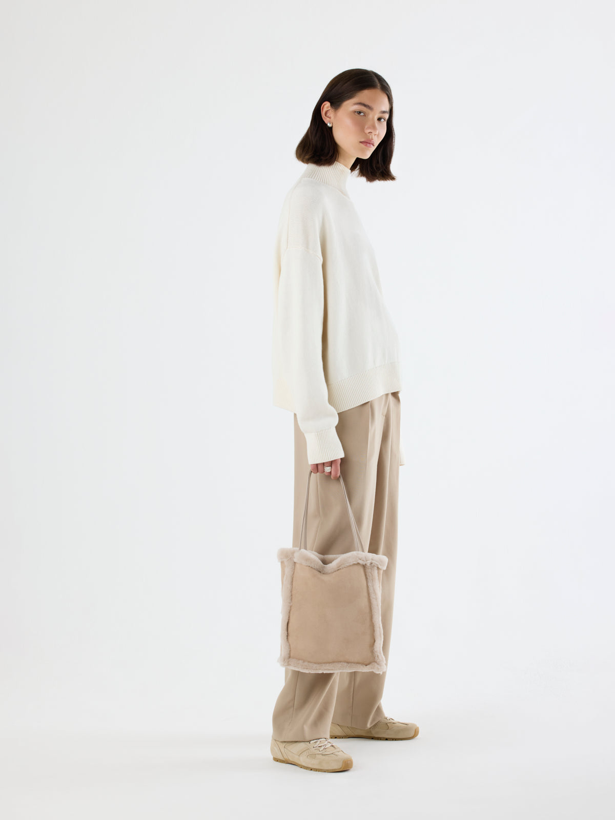 woman wearing Nell Merino Cream Shearling Tote Bag by gushlow & cole