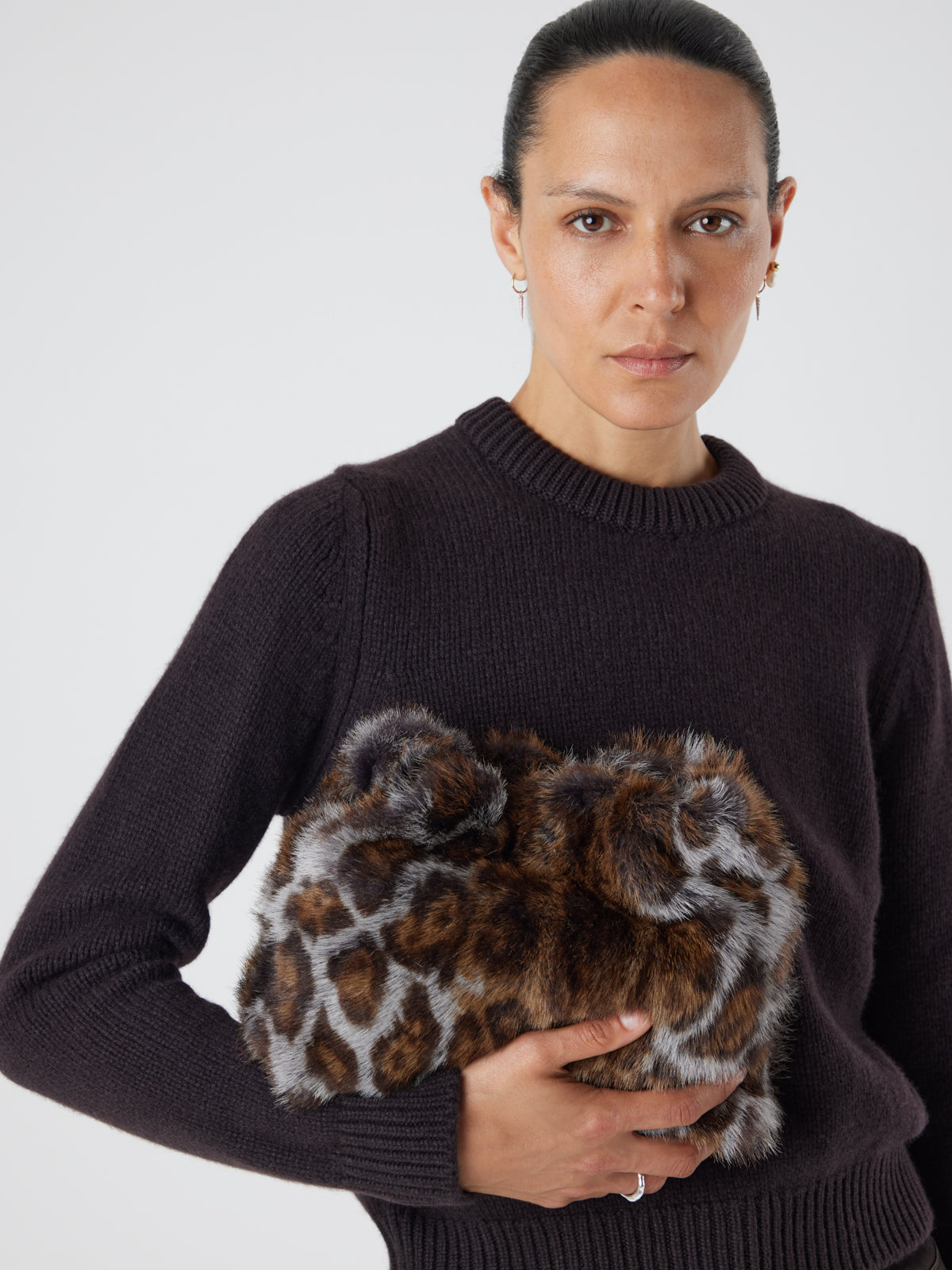 Ocelot Print Soft Shearling Clutch Bag | Womens | Gushlow & Cole - model holding bag as pouch