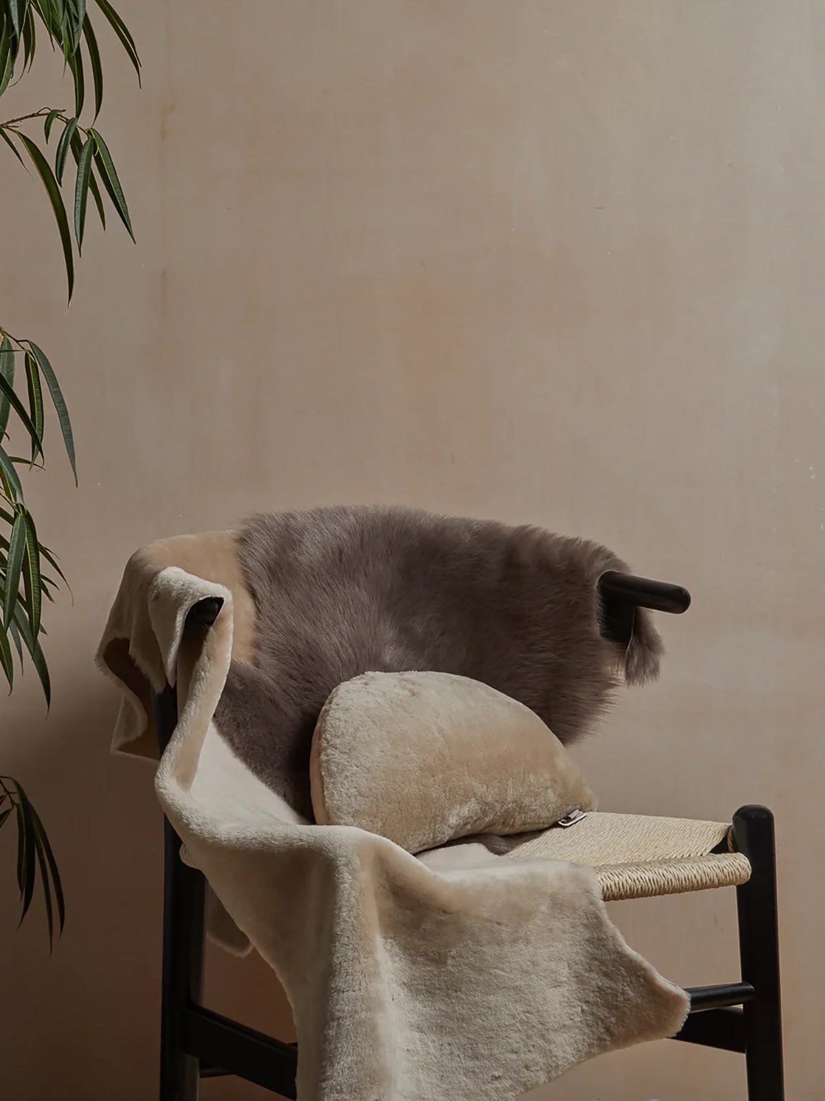 Small Toscana Sheepskin Rug in taupe with moon cushion gushlow and cole homeware lifestyle