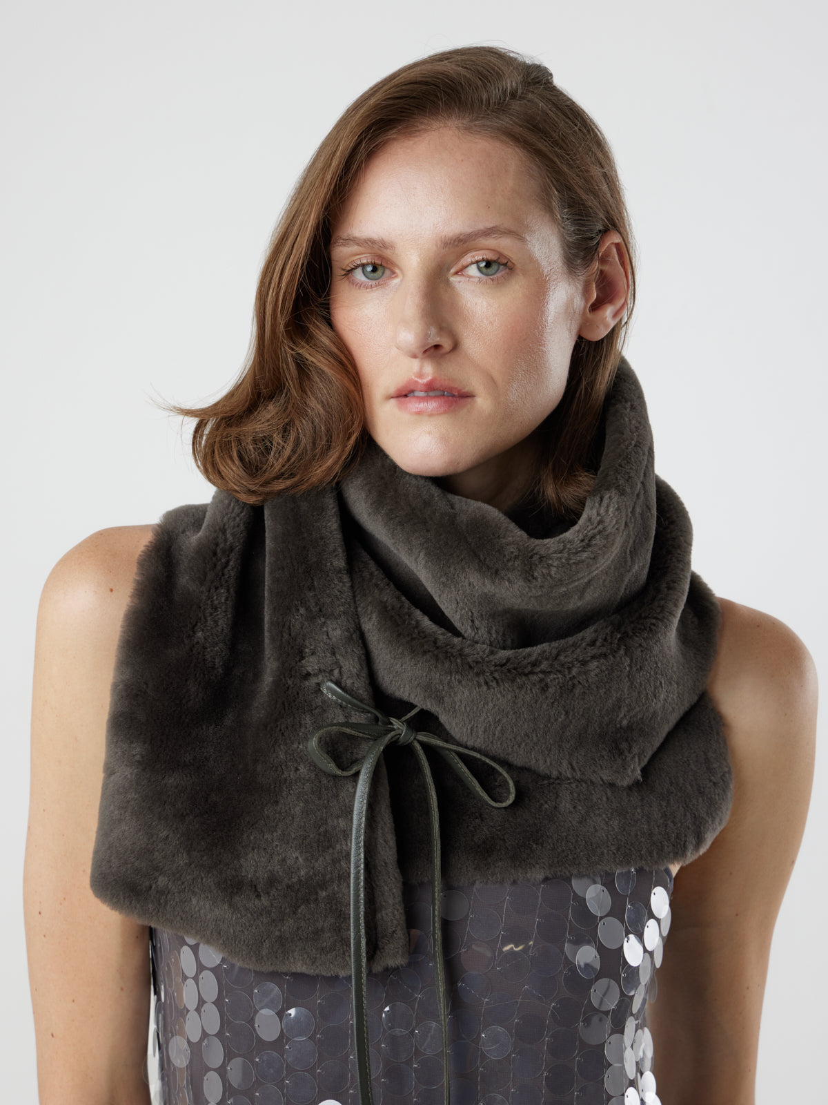 woman wearing storm brown shearling shawl scarf by gushlow & cole tied as a snood