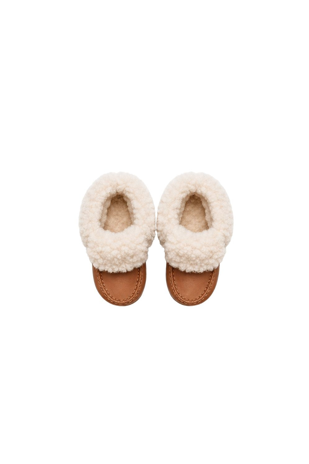pair of kids tan and cream sheepskin baby boots on white background by gushlow & cole