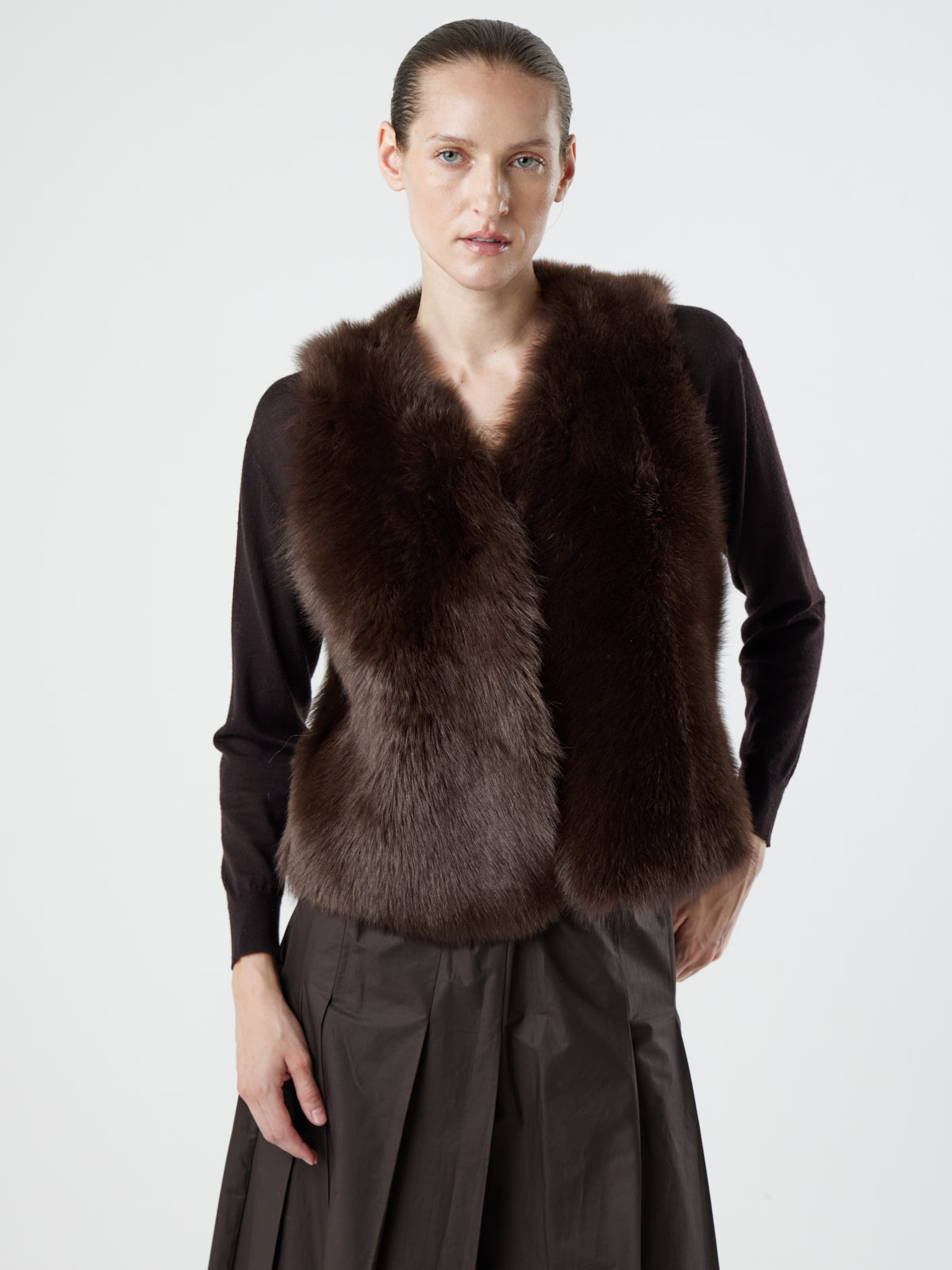 woman wearing Two Button Brown Shearling Vest by Gushlow & Cole over brown jumper on white background