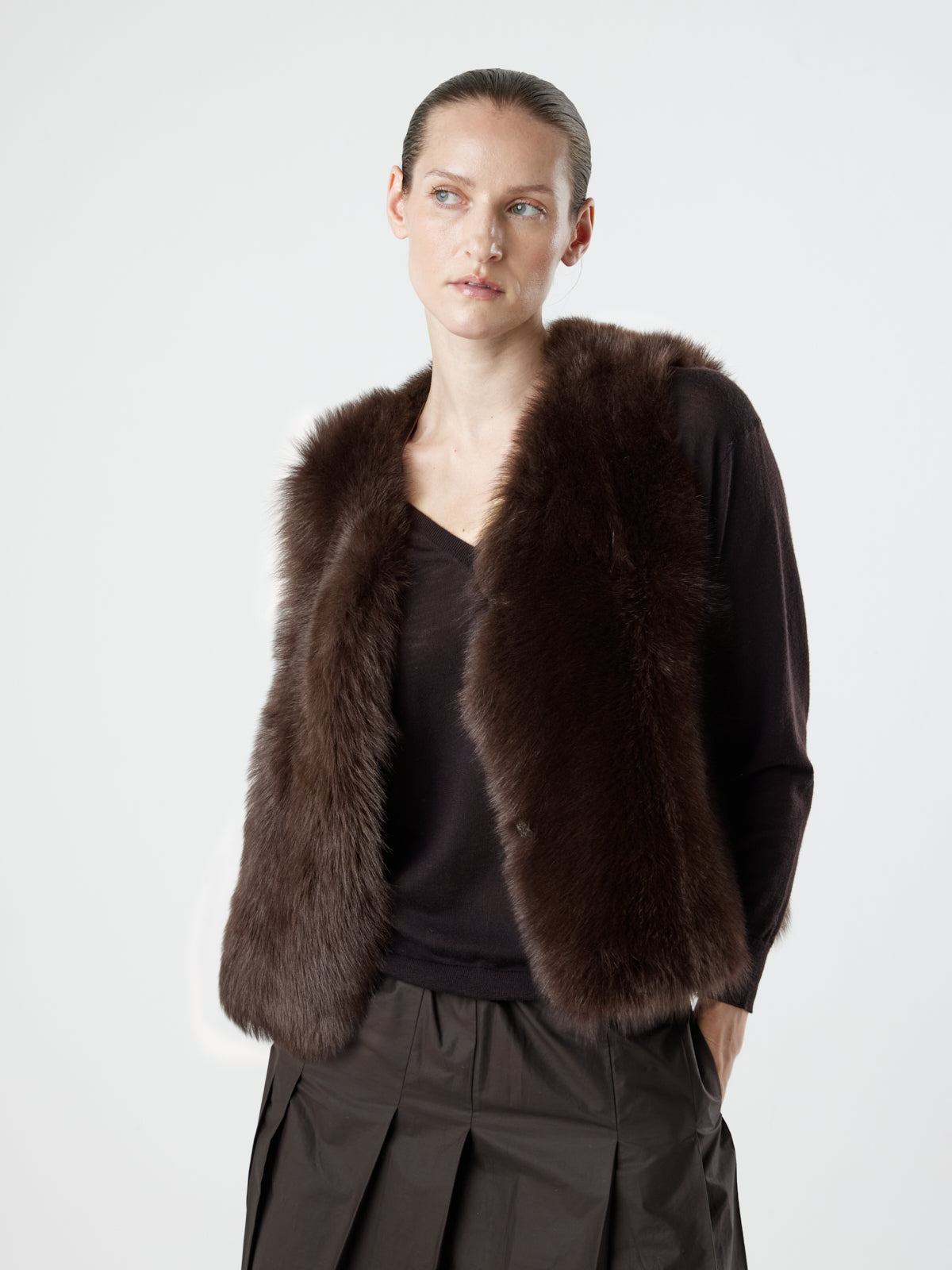 woman wearing Two Button Brown Shearling Vest by Gushlow & Cole over brown jumper on white background
