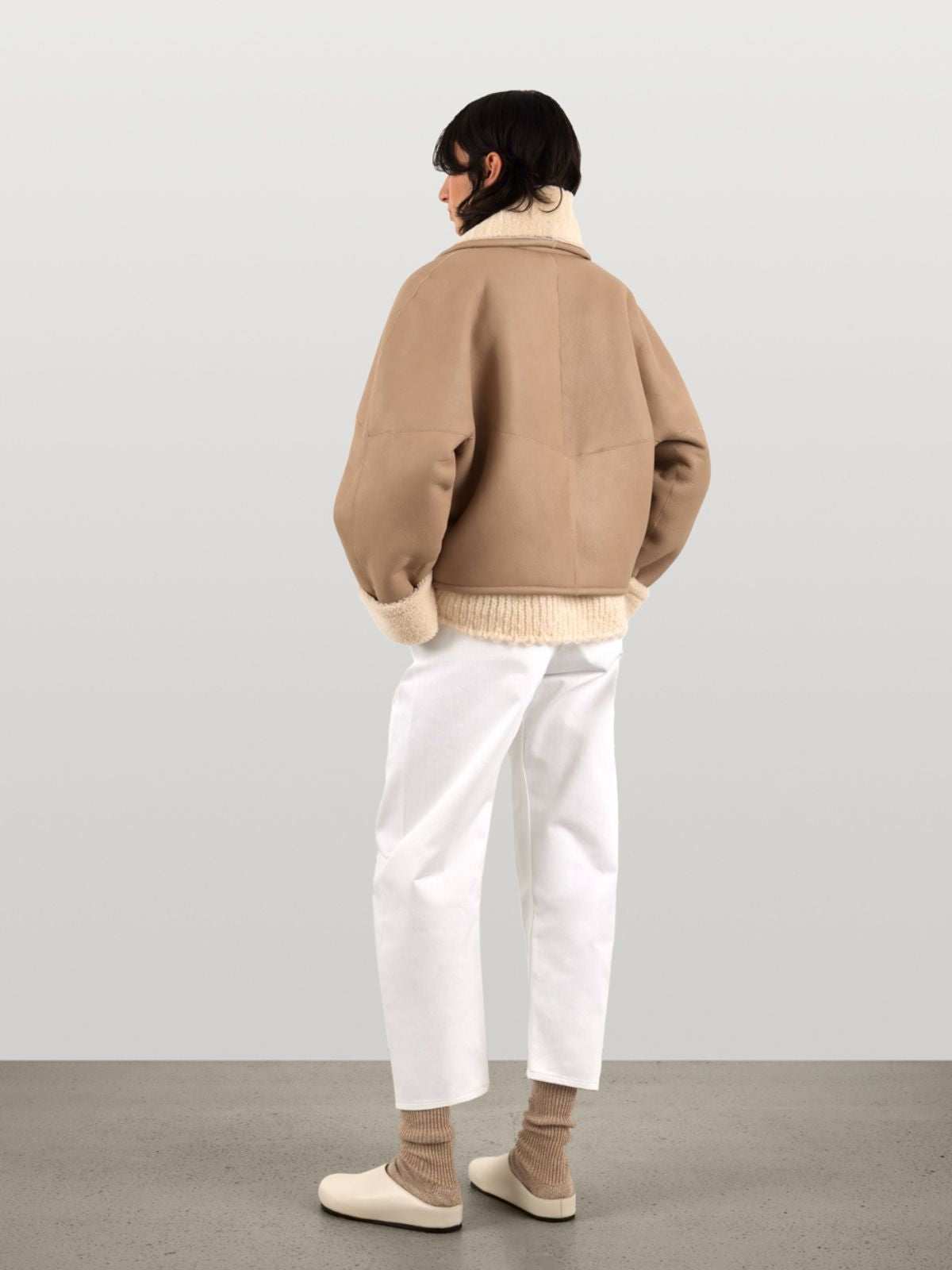 back view of woman wearing White L9020 Crop Shearling Jacket by Gushlow & Cole on white background