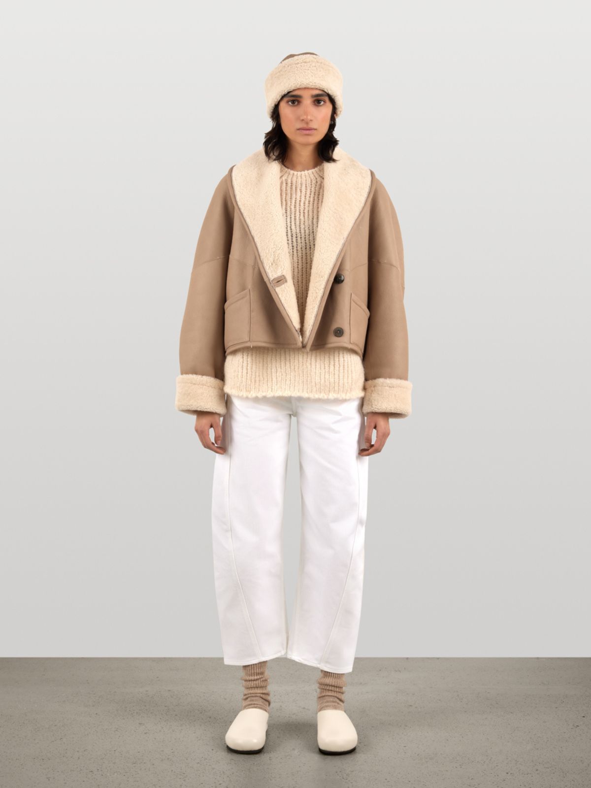 woman wearing White L9020 Crop Shearling Jacket and white chiswick shearling hat by Gushlow & Cole on white background