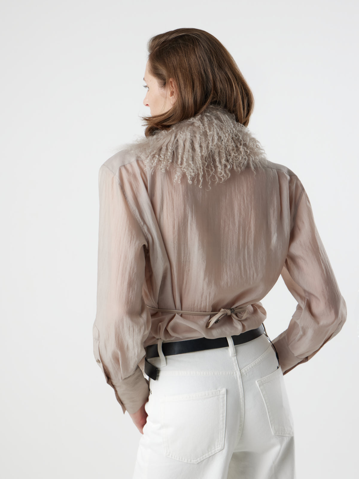 back view of woman wearing oyster White Mongolian Shearling Shawl Scarf by gushlow & cole. sheepskin Shawl Scarf