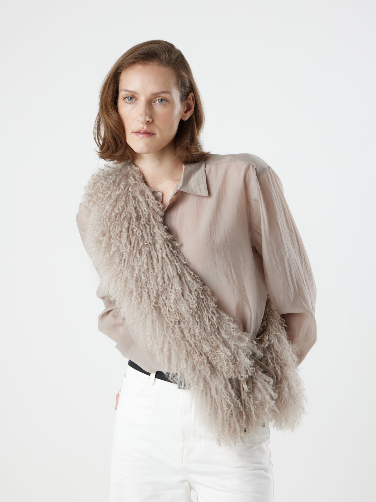 woman wearing oyster White Mongolian Shearling Shawl Scarf styled as sash by gushlow & cole. sheepskin Shawl Scarf