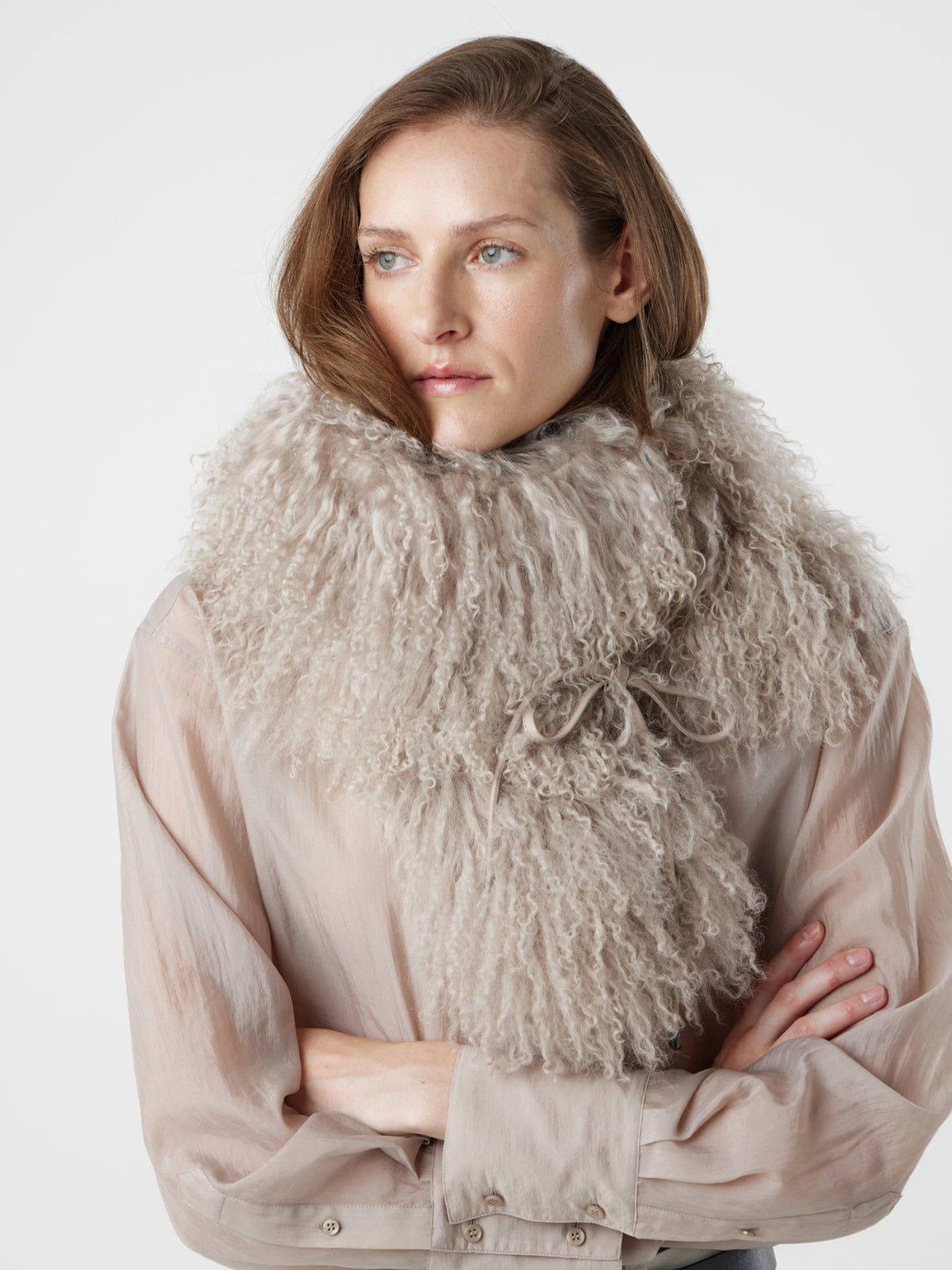 woman wearing oyster White Mongolian Shearling Shawl Scarf styled as snood by gushlow & cole. sheepskin Shawl Scarf