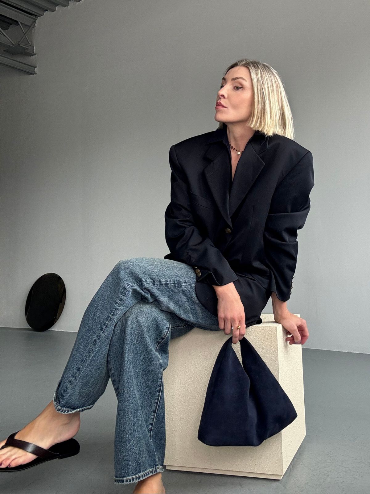 yara svalek wearing navy blue suede mini shoulder bag - luxury womens shearling gushlow & cole