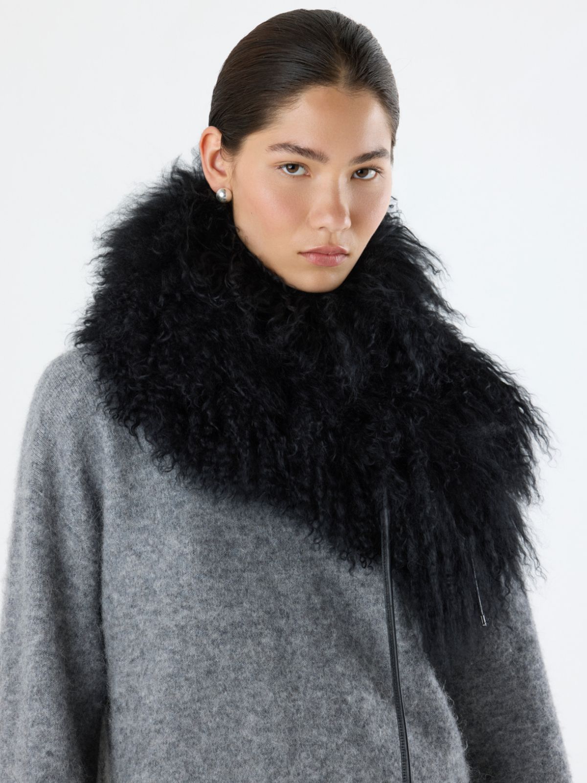 woman wearing gushlow & Cole black mongolian shawl scarf