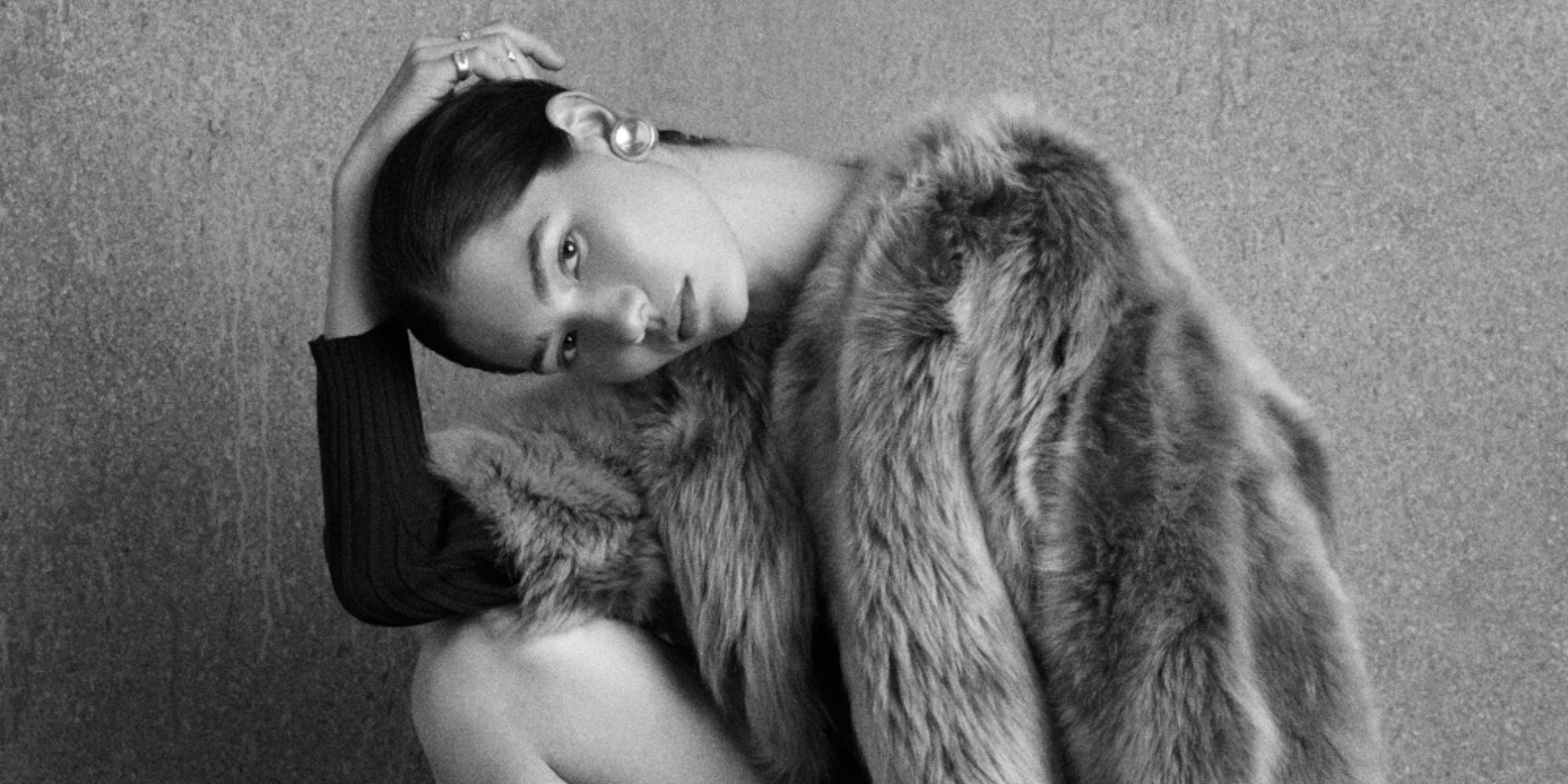 woman wearing shearling jacket on grey background - luxury womens shearling gushlow & cole 
