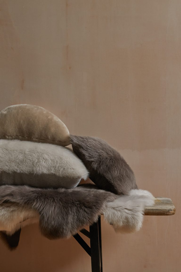 Double Toscana Sheepskin Rug in taupe with cushions gushlow and cole homeware lifestyle