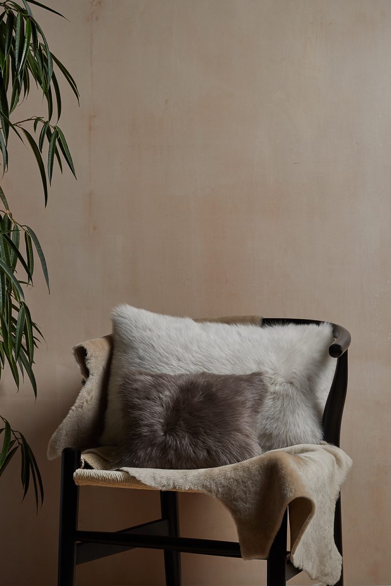 Medium Merino Sheepskin Rug in beige and cushion gushlow and cole homeware lifestyle