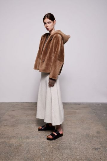Camel Hooded Shearling Jacket - model full length side - women | Gushlow & Cole