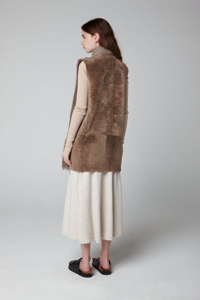Camel Mid Length Rough Cut Mixed Shearling Gilet - model full length wool out back - women | gushlow & cole