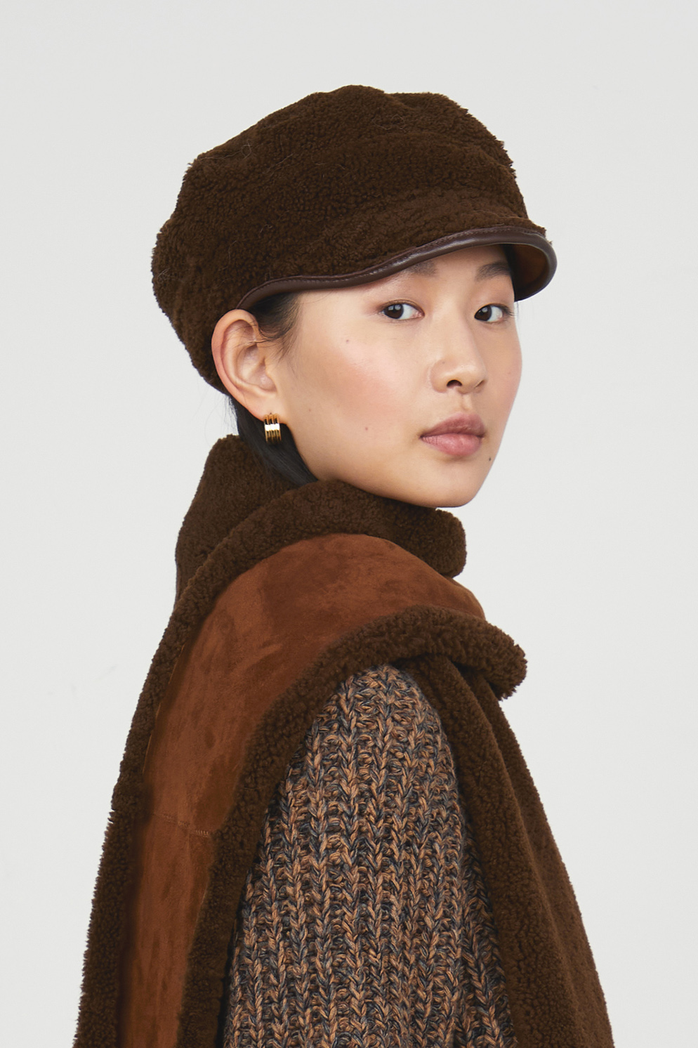 Chestnut Brown Hackney Shearling Cap gushlow and cole - model portrait side