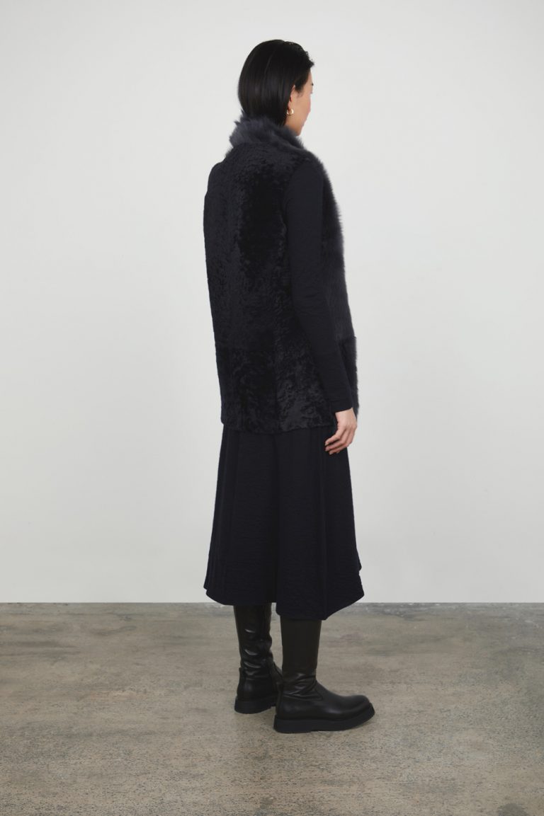 Graphite Black Mid Length Natural Cut Mixed Shearling Gilet gushlow and cole womens shearling model back