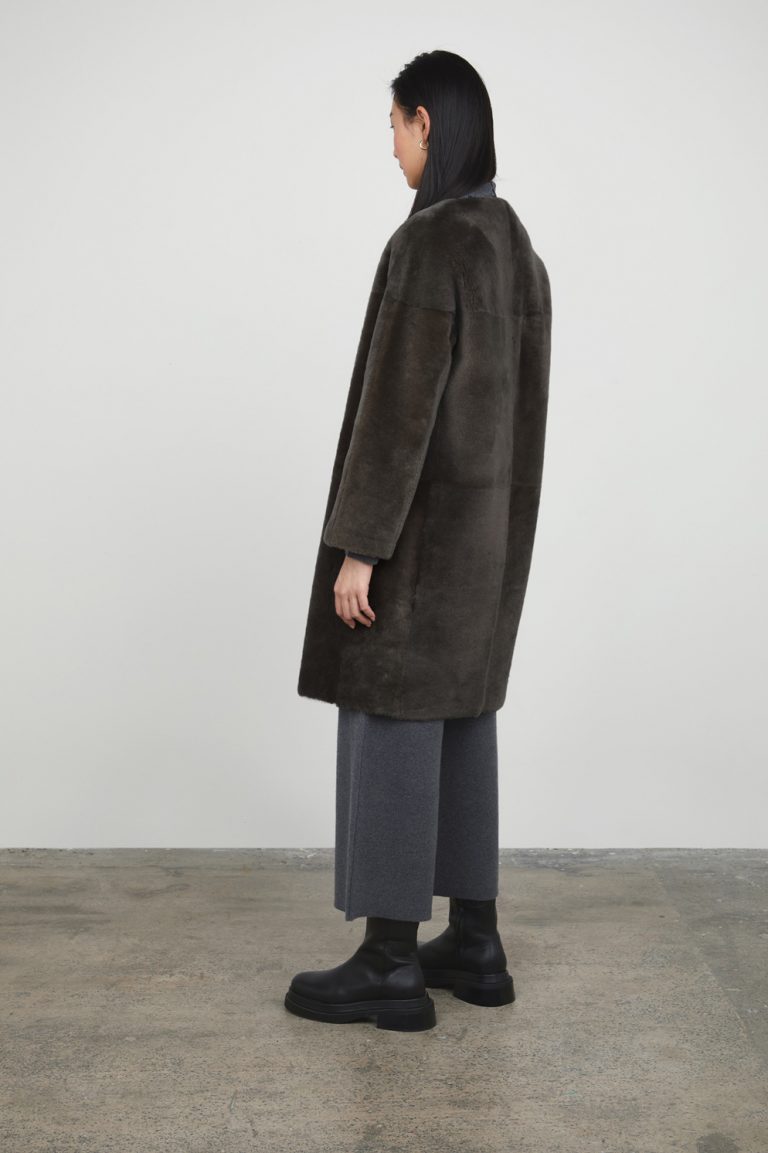 Storm Grey Collarless Shearling Coat gushlow and cole womens shearling model full length back