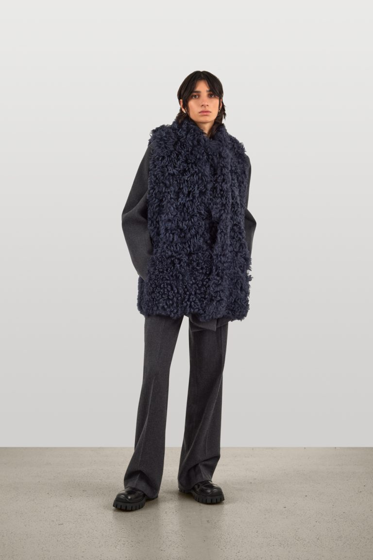 Mid Length Natural Cut Navy Shearling Gilet | Womens | Gushlow & Cole - model full length front 2