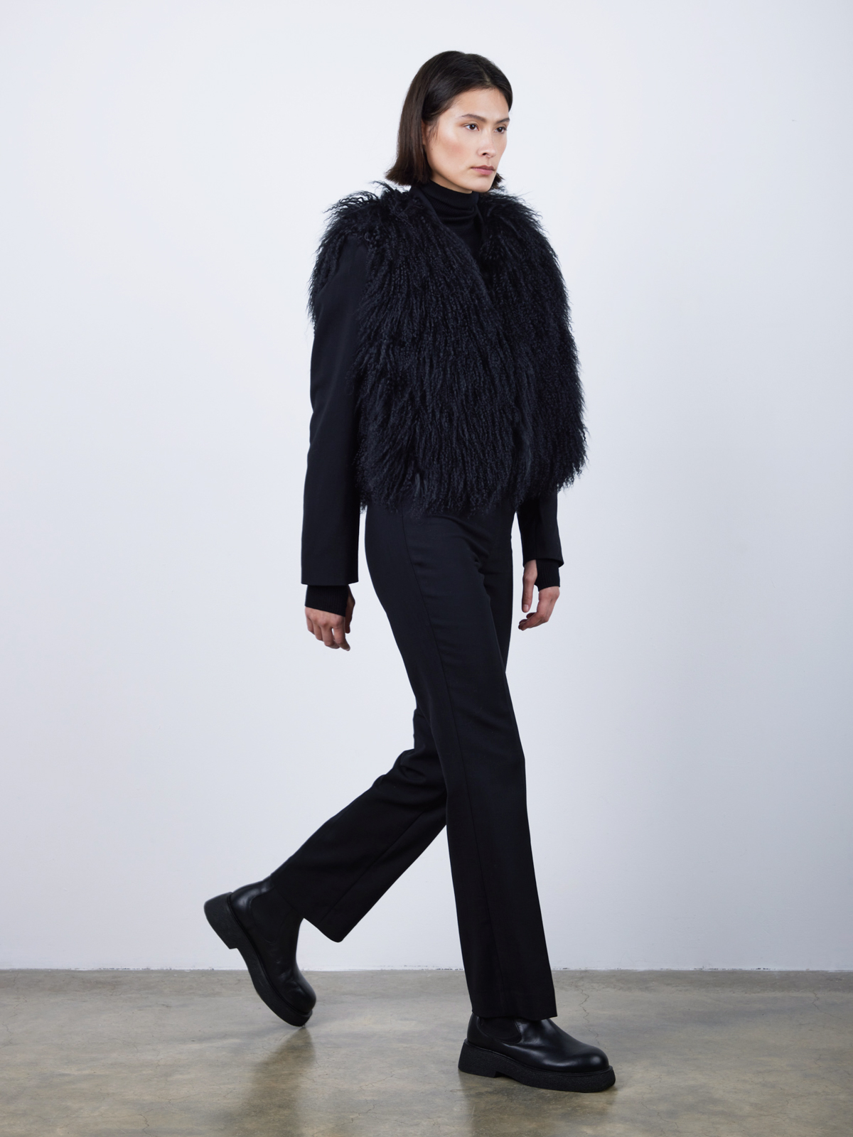 Black Mongolian Shearling Gilet | Womens | Gushlow & Cole-model wearing gilet walking
