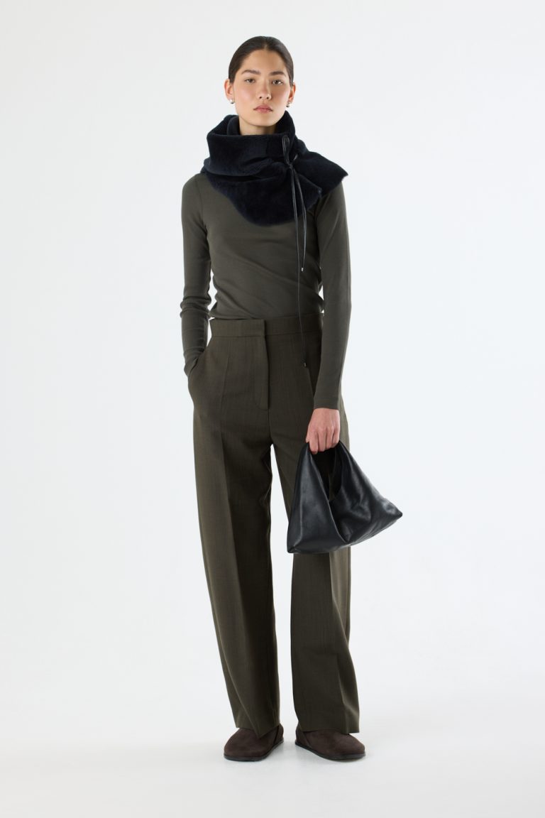 Clara Small Black Leather Shoulder Bag | Bags | Gushlow & Cole - model full length holding bag