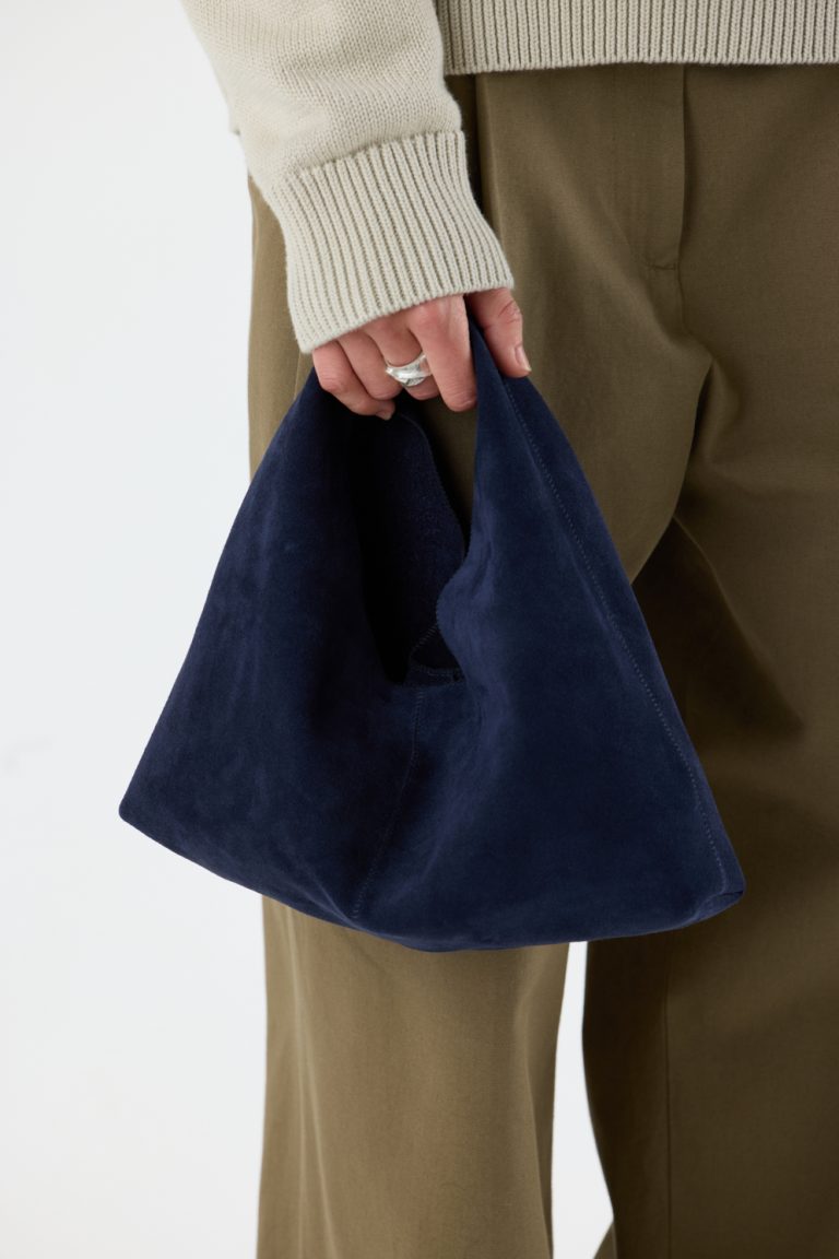 Clara Small Navy Blue Suede Shoulder Bag | Bags | Gushlow & Cole - crop model holding bag