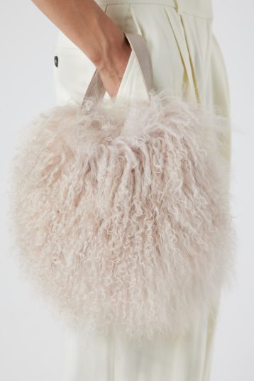 Mongolian Shearling Cream Saddle Bag | Bags | Gushlow & Cole - model crop in
