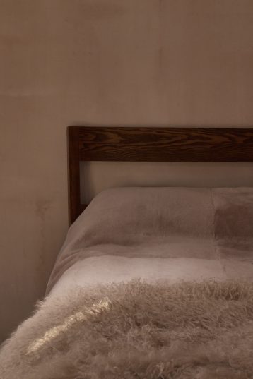 Camel Mongolian Shearling Throw | Home | Gushlow & Cole - lifestyle image of throw on bed