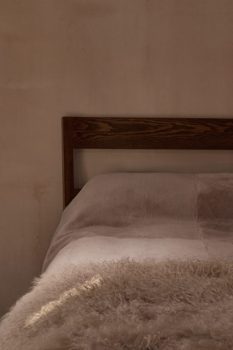 Camel Mongolian Shearling Throw | Home | Gushlow & Cole - lifestyle image of throw on bed
