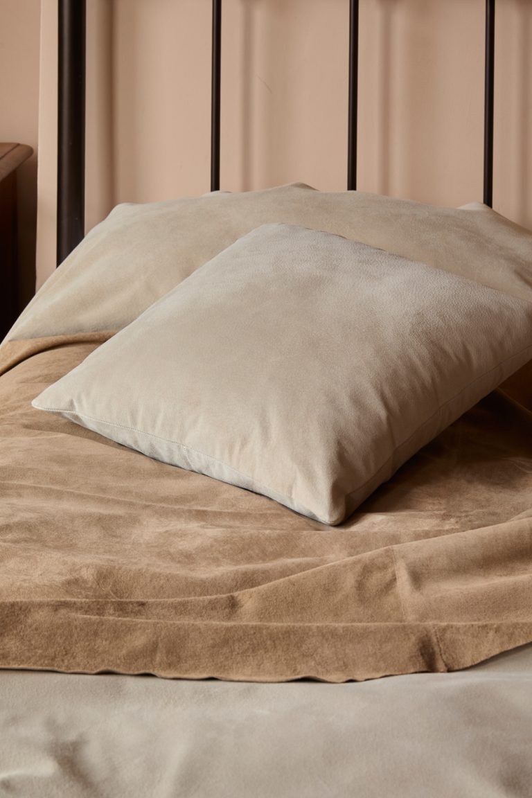 Camel Suede Throw | Home | Gushlow & Cole - lifestyle image of throw on bed with suede cushion