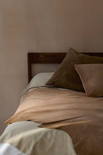 Large Camel Suede Throw | Home | Gushlow & Cole - lifestyle image of suede throw on bed with suede cushions