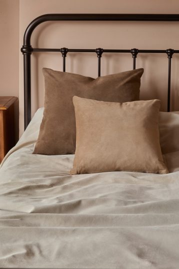 Large Stone White Suede Throw | Home | Gushlow & Cole - lifestyle shot suede throws on bed with suede cushions